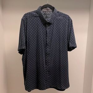 Mens navy blue short sleeve dress shirt with diamond pattern.